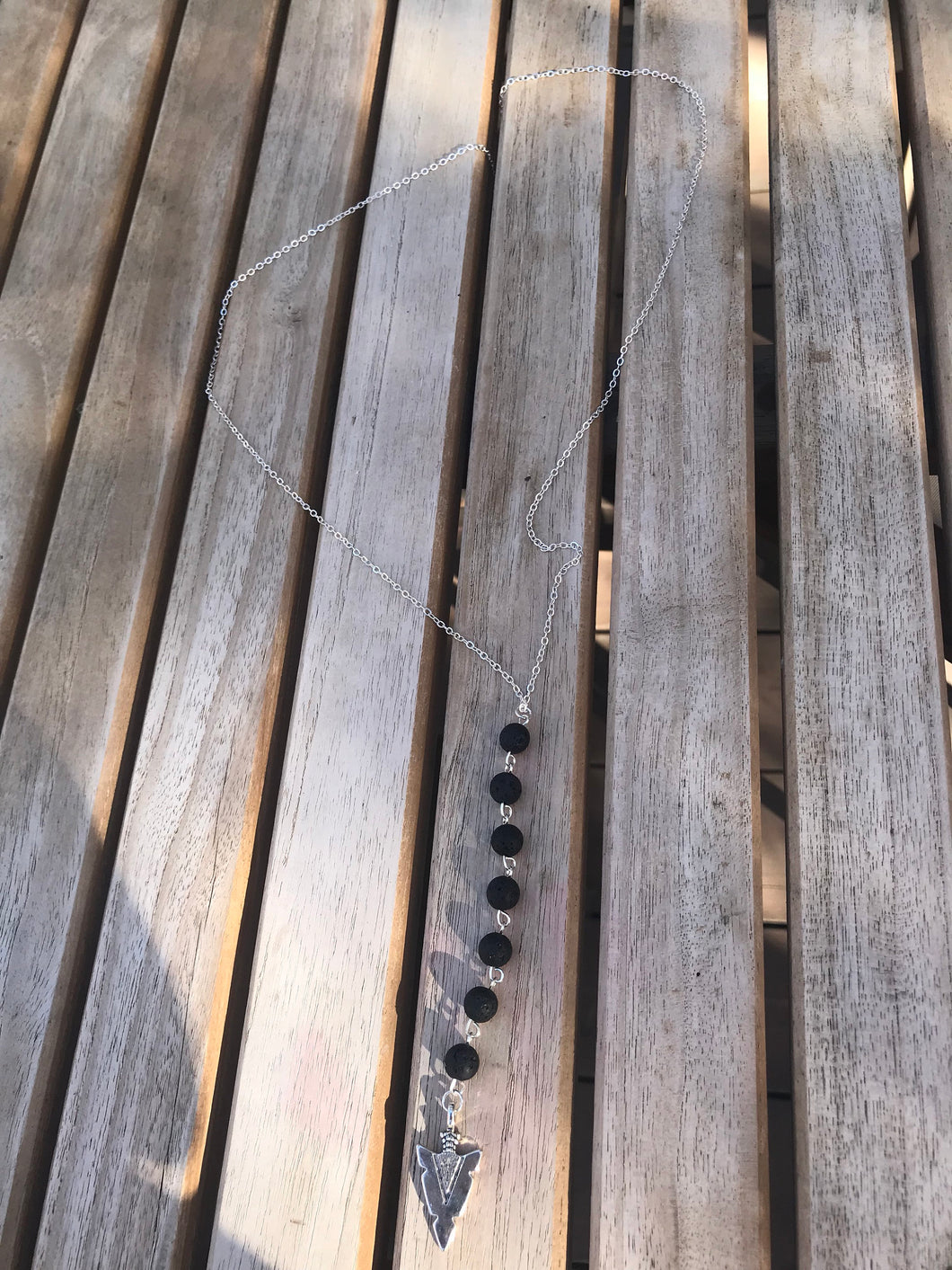 Long silver arrowhead lava bead essential oil diffuser necklace